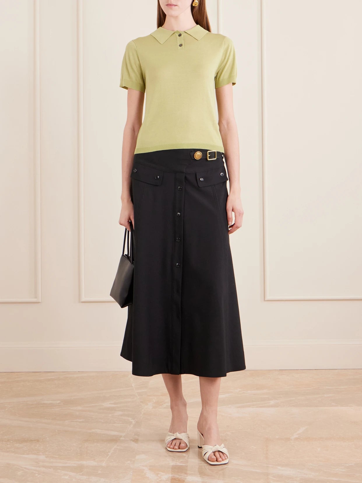 Image of a model wearing Outerwear. Product name - Daughter Jersey Polo Shirt in Green colour by brand - Still Here