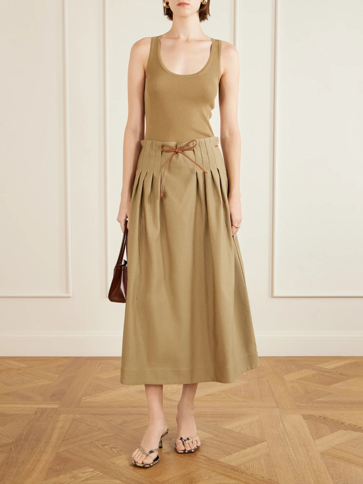 Image of a model wearing Tops. Product name - Ribbed Woven Tank in Army green colour by brand - Max Mara