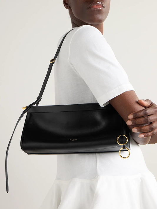 Image of Bags. Product name - Click E/w Medium Leather Shoulder Bag in Black colour by brand - Alaïa
