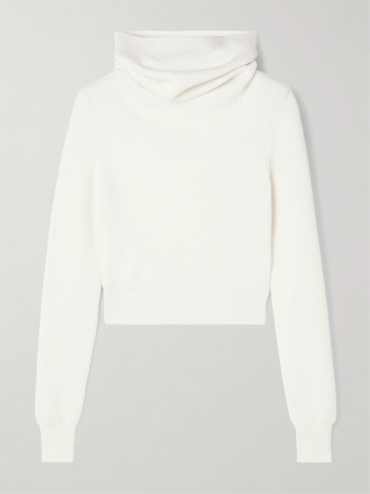 Image of a model wearing Tops. Product name - Hooded Cropped Ribbed Wool-blend Sweater in White colour by brand - Alaïa