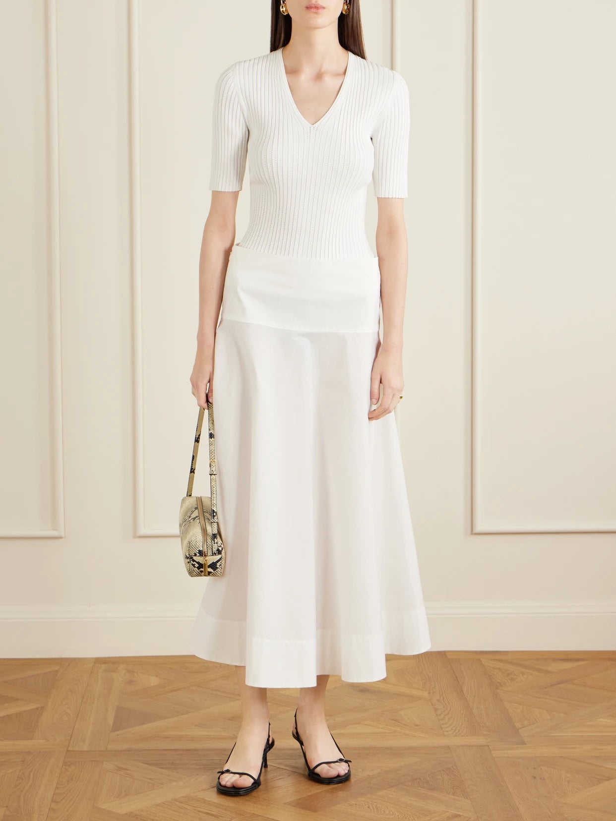 Image of a model wearing Tops. Product name - Pointelle-knit Crepe T-shirt in White colour by brand - Theory