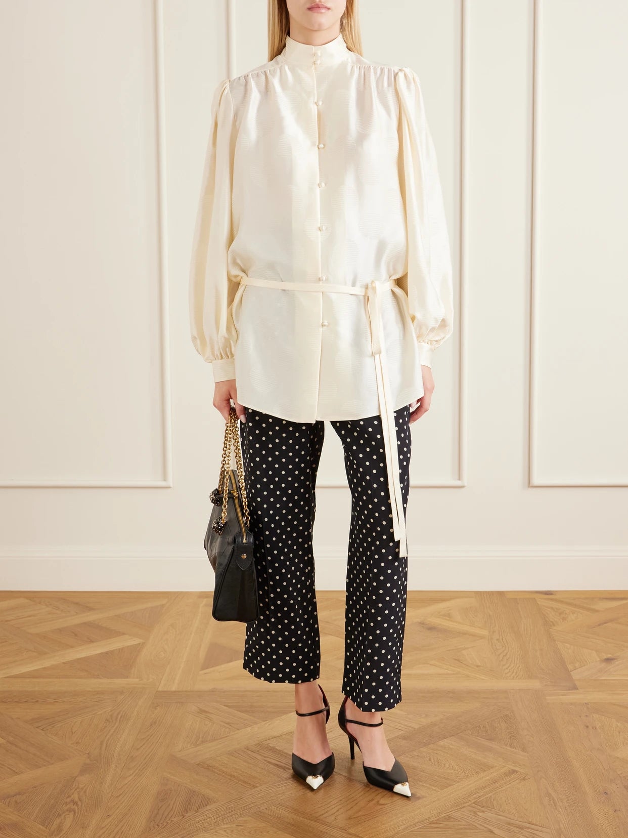 Image of a model wearing Pants. Product name - Polka-dot Silk Crepe De Chine Wide-leg Pants in Black colour by brand - Valentino Garavani