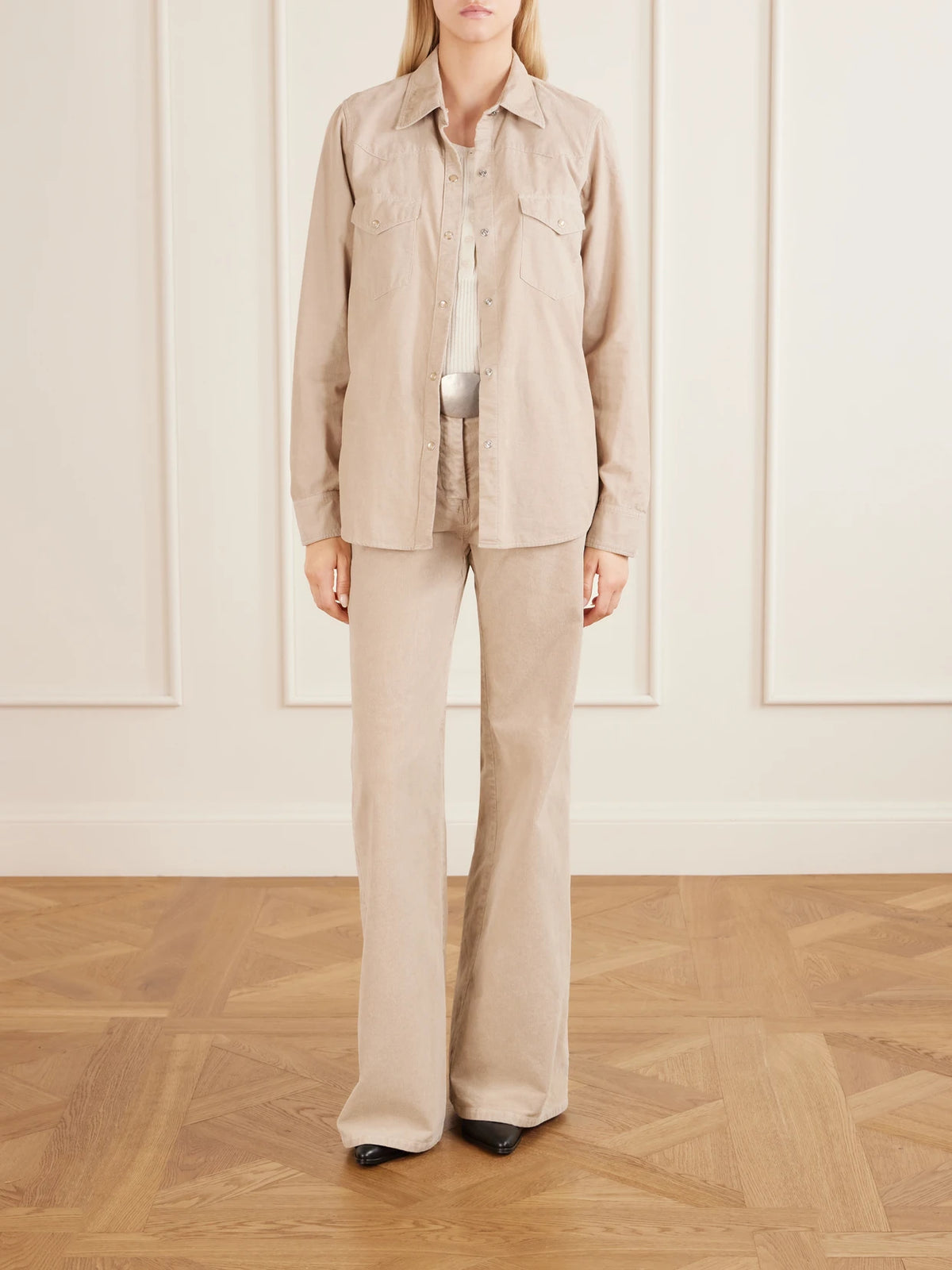 Image of a model wearing Tops. Product name - Travis Cotton Corduroy Shirt in Sand colour by brand - Nili Lotan