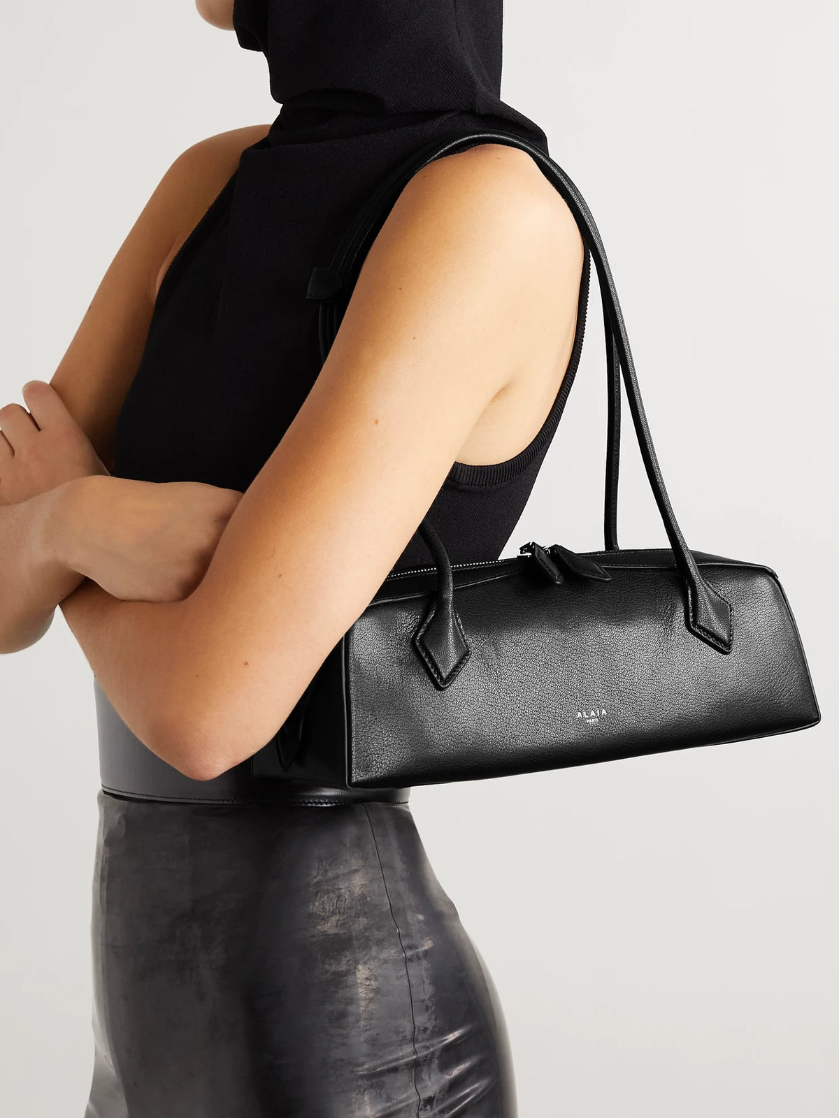 Image of Bags. Product name - Le Teckel Textured-leather Shoulder Bag in Black colour by brand - Alaïa