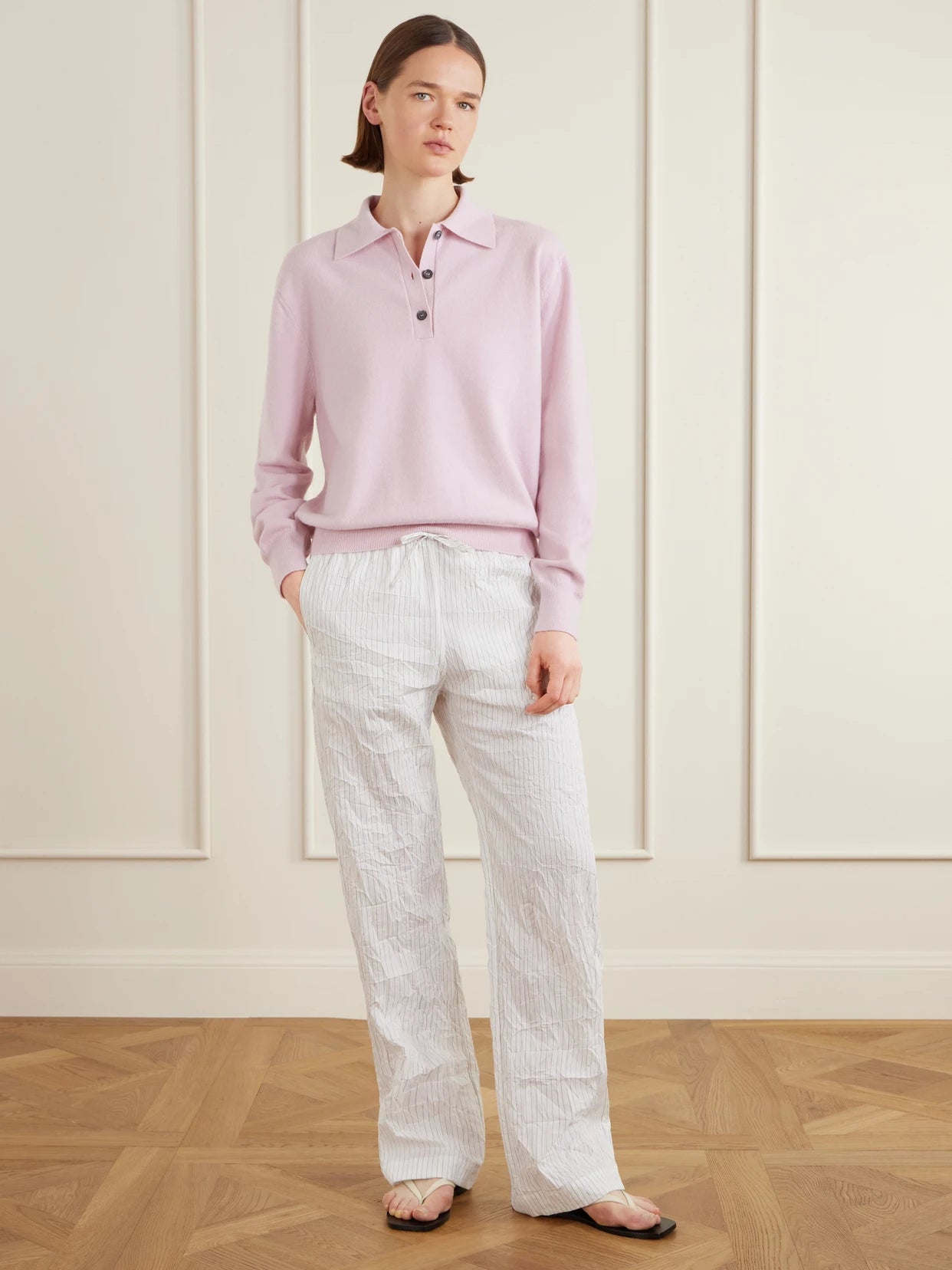 Image of a model wearing Outerwear. Product name - Wool-blend Polo Sweater in Pink colour by brand - RÓHE