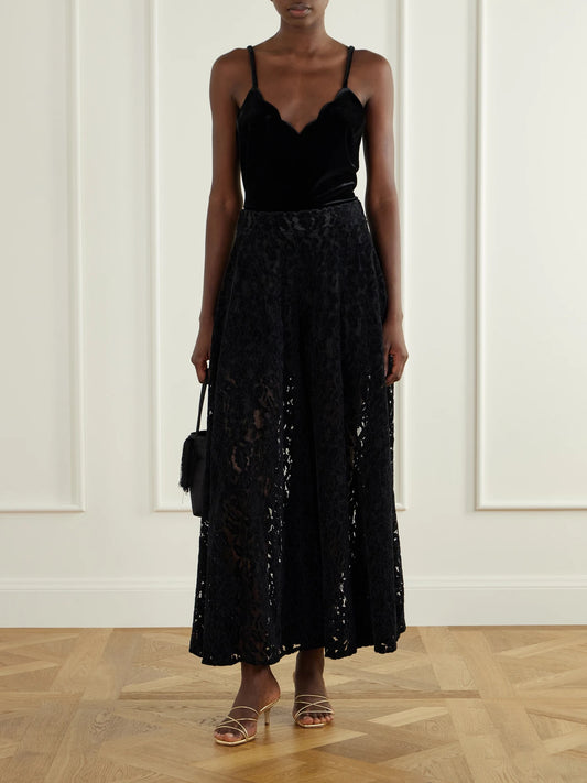 Image of a model wearing Tops. Product name - Pyrite Scalloped Velvet Cami in Black colour by brand - Loretta Caponi