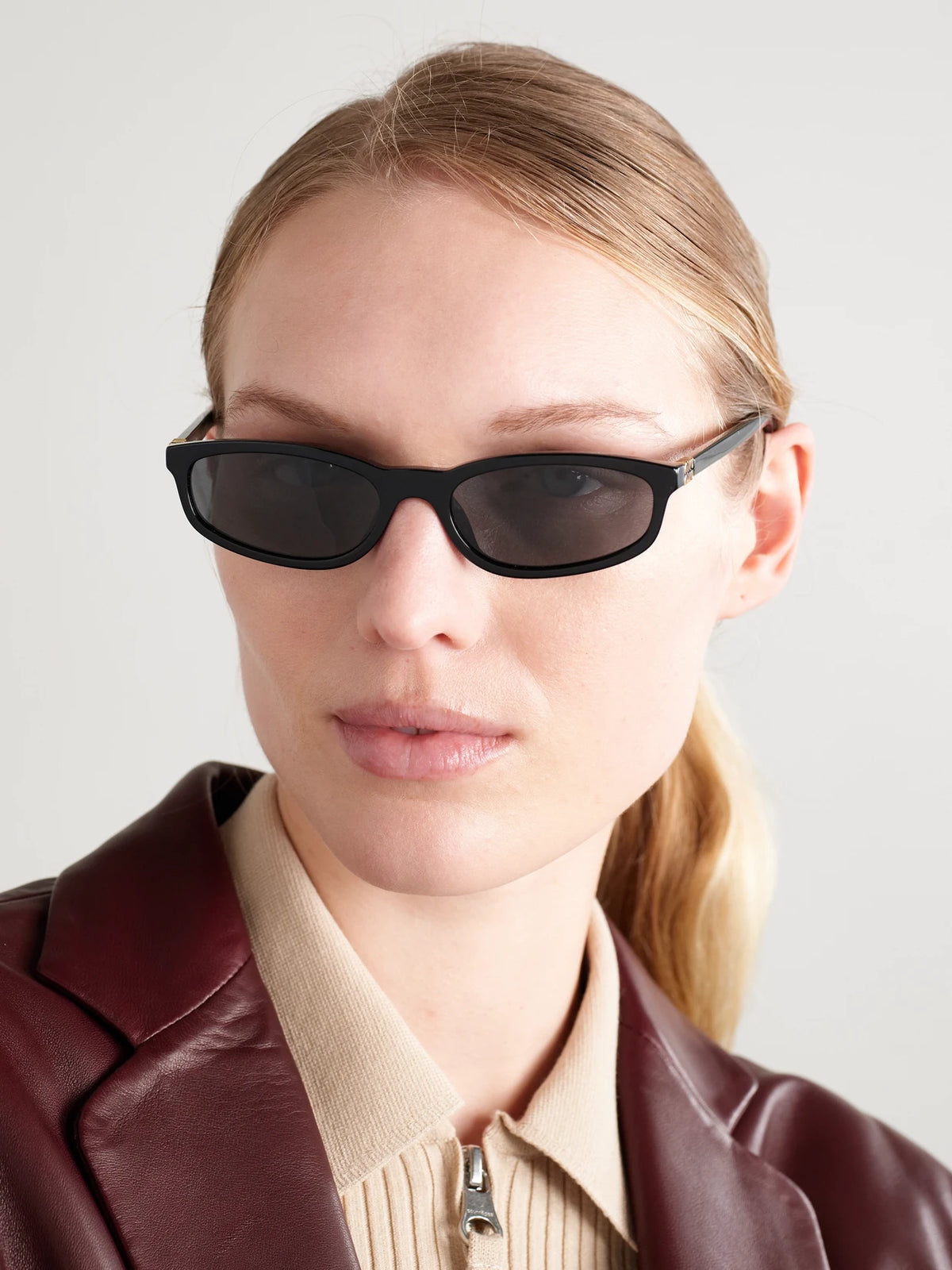 Image of Sunglasses. Product name - Oval-frame Acetate Sunglasses in Black colour by brand - Miu Miu Eyewear