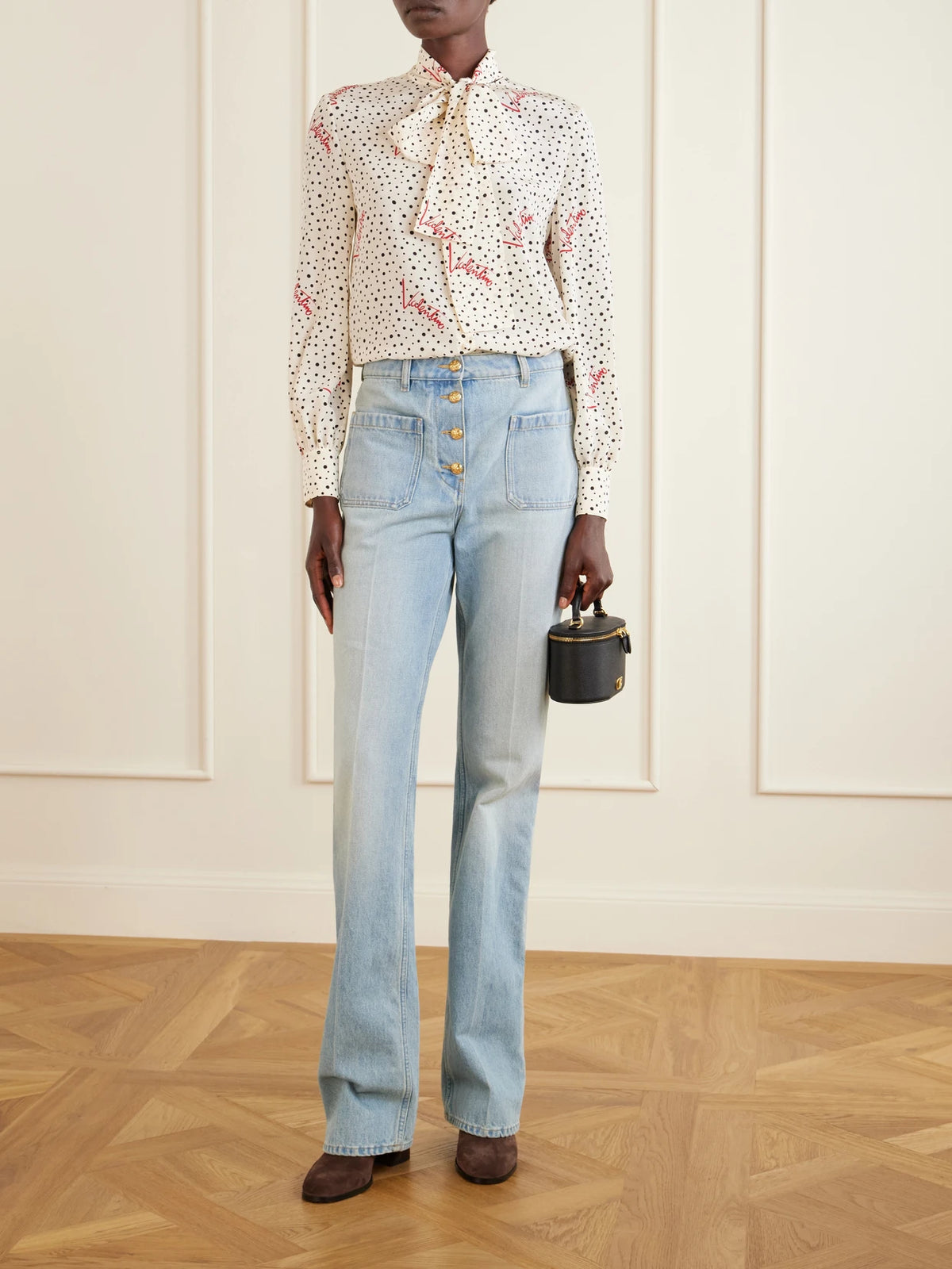 Image of a model wearing Tops. Product name - Pussy-bow Polka-dot Silk Crepe De Chine Blouse in Cream colour by brand - Valentino Garavani