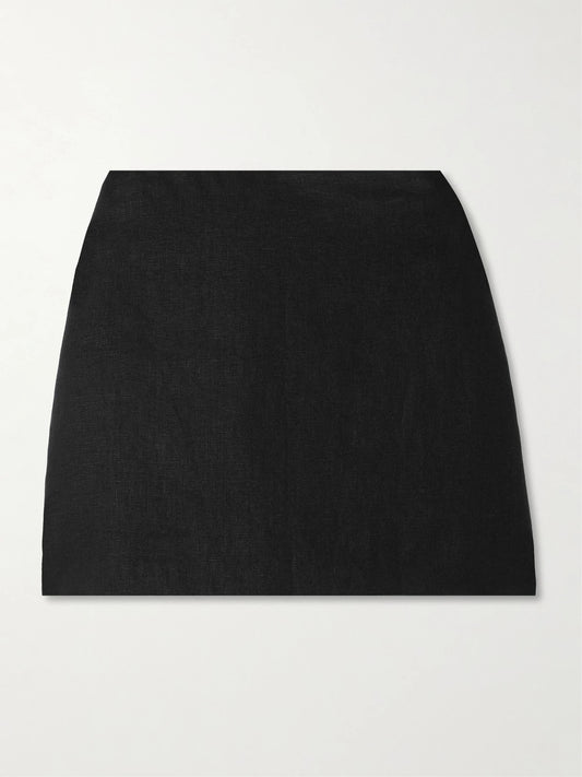 Image of a model wearing Skirts. Product name - Alice Linen Mini Skirt in Black colour by brand - Posse