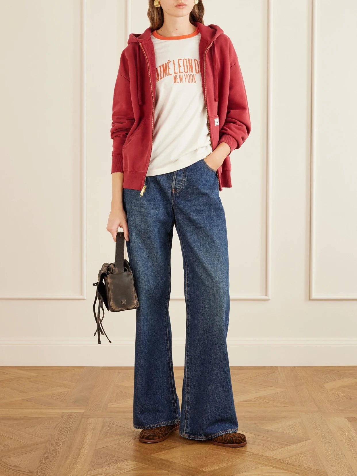 Image of a model wearing Tops. Product name - Vintage Cotton T-shirt in White colour by brand - Aimé Leon Dore