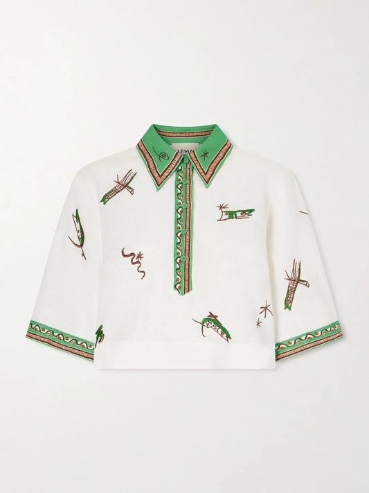 Image of a model wearing Tops. Product name - Wanda Printed Embroidered Linen Shirt in Ivory colour by brand - ALÉMAIS