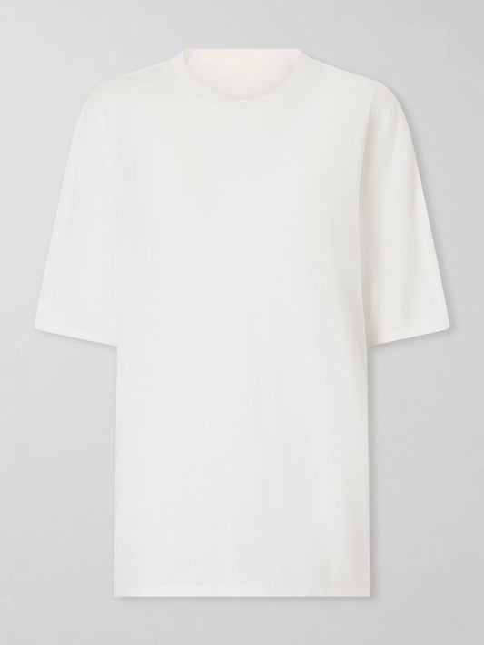Image of a model wearing Tops. Product name - Supima Cotton-jersey T-shirt in White colour by brand - TWP