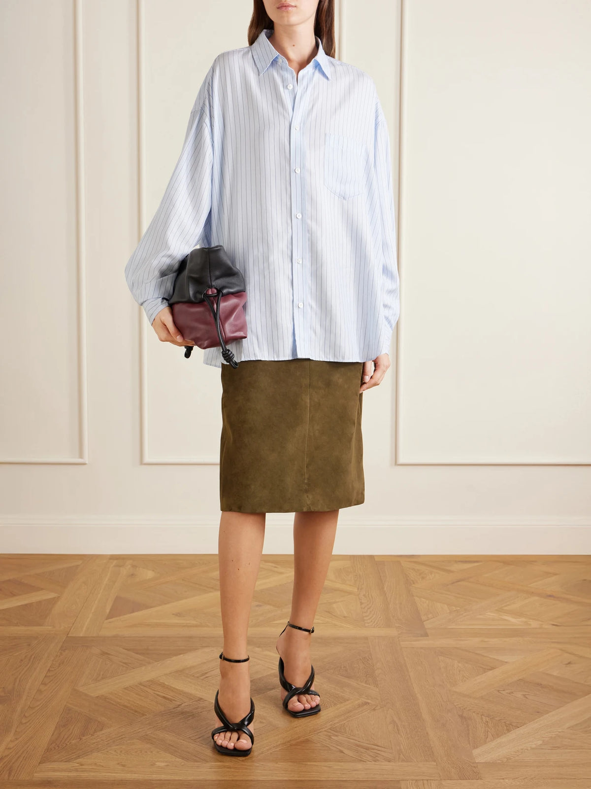 Image of a model wearing Skirts. Product name - Irine Suede Midi Skirt in Forest green colour by brand - Proenza Schouler
