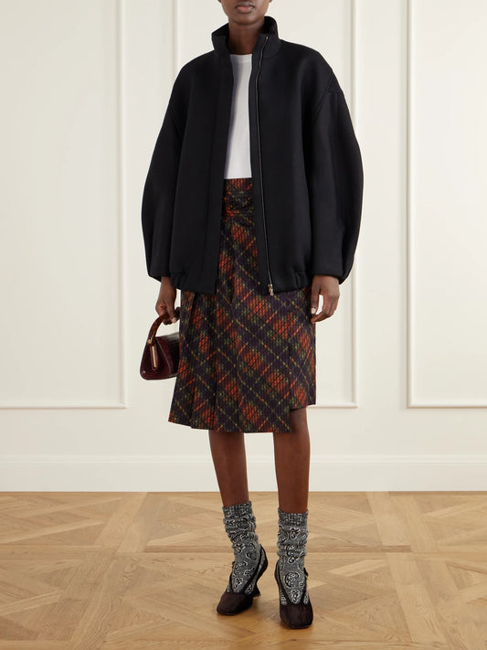 Image of a model wearing Skirts. Product name - Checked Pleated Cotton Midi Skirt in Multi colour by brand - Dries Van Noten