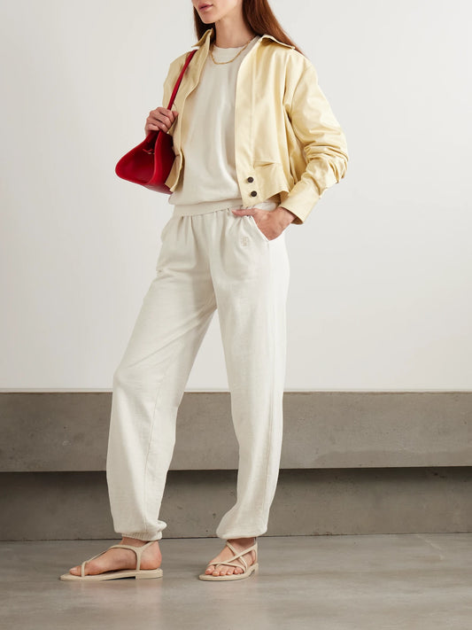 Image of Sleepwear & Loungewear. Product name - Vinny Embroidered Tapered Cotton-jersey Track Pants in Beige colour by brand - ÉTERNE