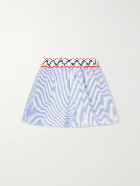 Image of a model wearing Shorts. Product name - Embroidered Striped Linen Shorts in Blue colour by brand - Farm Rio