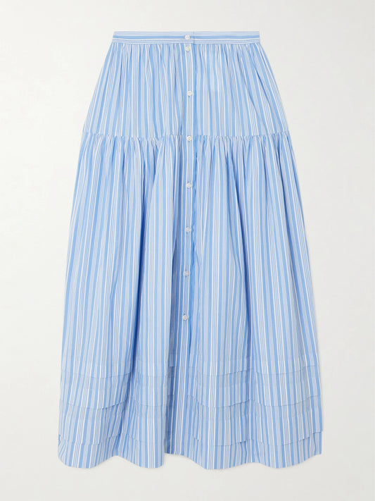 Image of a model wearing Skirts. Product name - Marceline Tiered Striped Organic Cotton Midi Skirt in Blue colour by brand - DÔEN