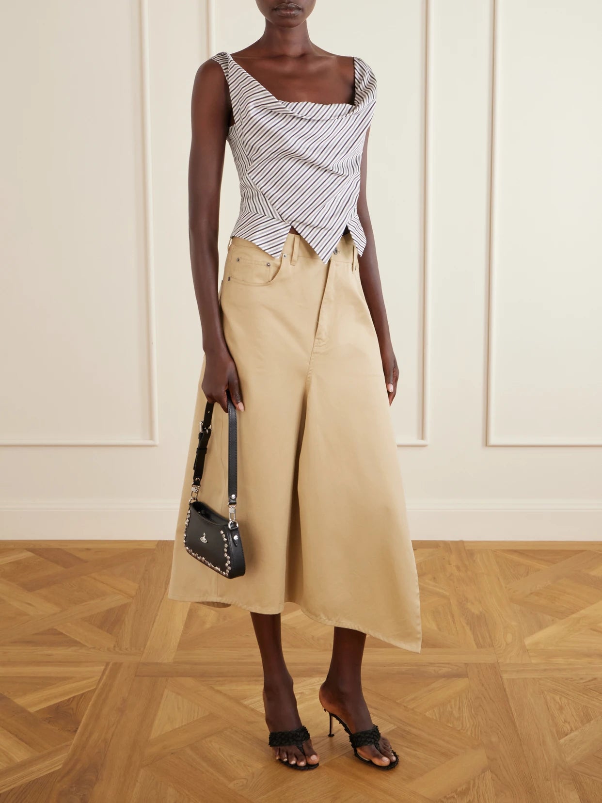 Image of a model wearing Tops. Product name - Sunday Asymmetric Striped Cotton-poplin Blouse in Gray colour by brand - Vivienne Westwood