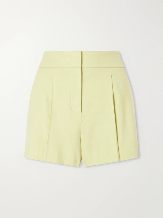 Image of a model wearing Shorts. Product name - Haina Pleated Linen-blend Twill Shorts in Light green colour by brand - Veronica Beard