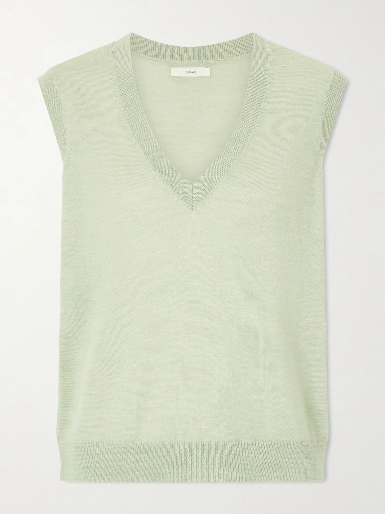 Image of a model wearing Outerwear. Product name - Amara Merino Wool Vest in Green colour by brand - SKALL