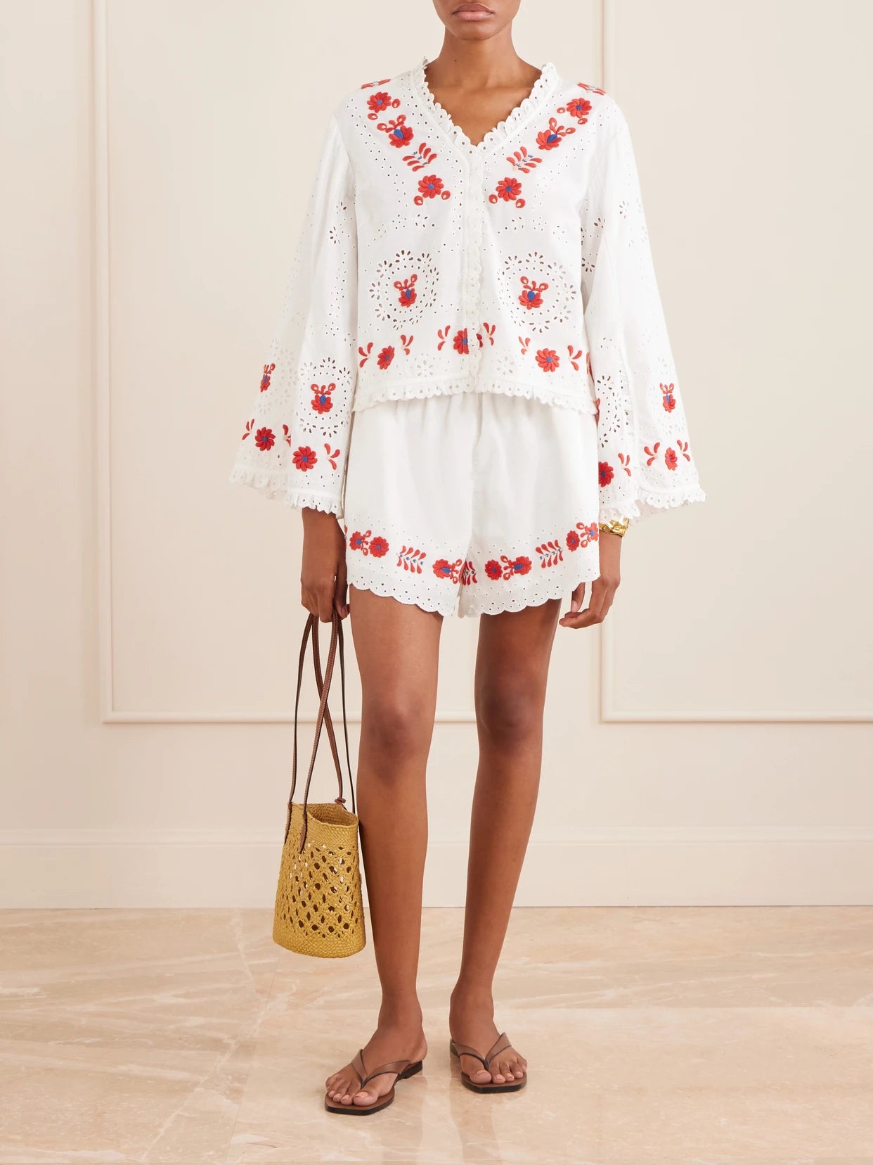 Image of a model wearing Shorts. Product name - Catharina Embroidered Cotton And Linen Shorts in Cream colour by brand - Sea