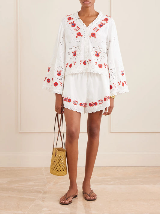 Image of a model wearing Shorts. Product name - Catharina Embroidered Cotton And Linen Shorts in Cream colour by brand - Sea