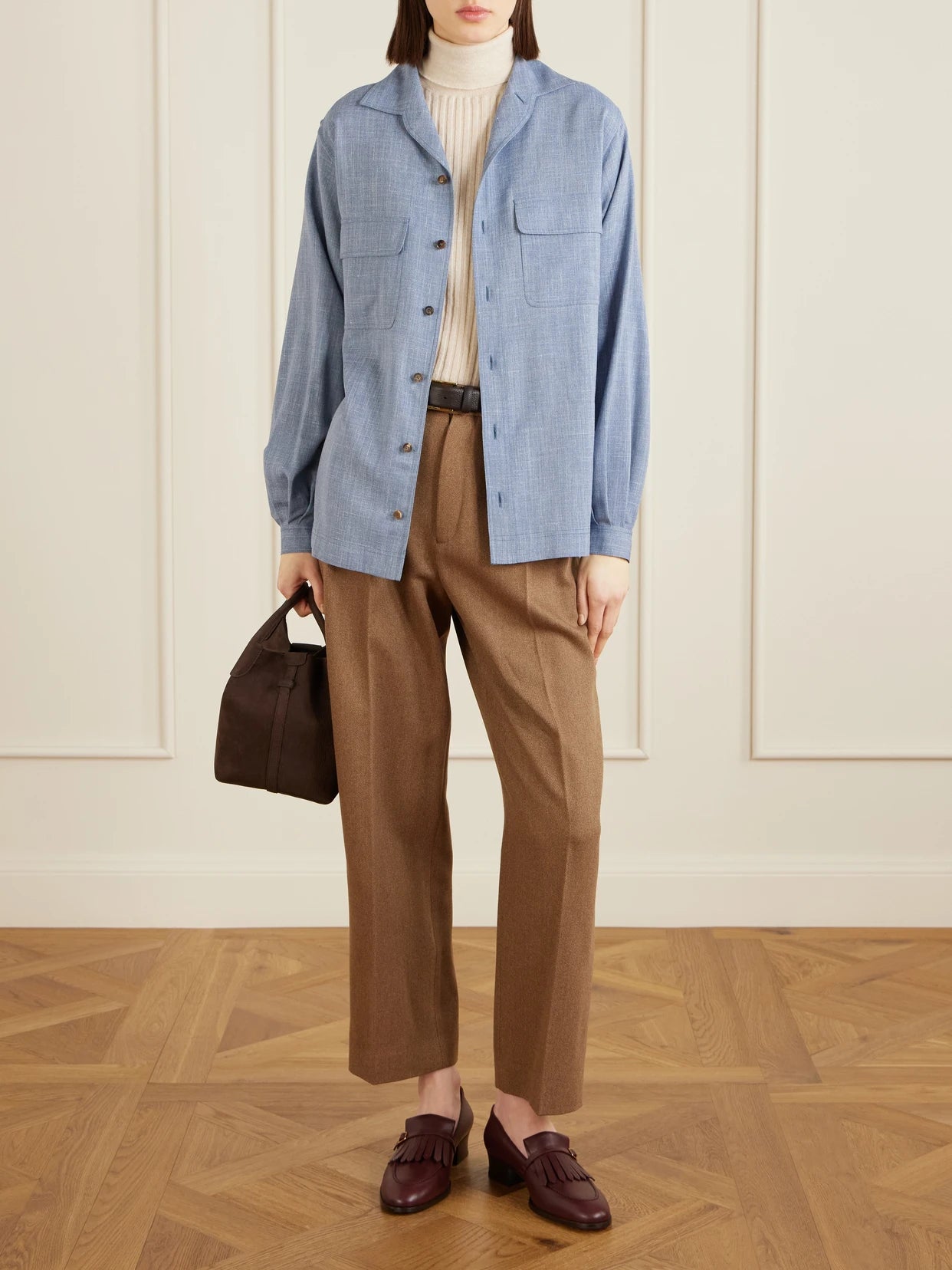Image of a model wearing Tops. Product name - Ida Wool, Silk And Linen-blend Shirt in Light blue colour by brand - Loro Piana