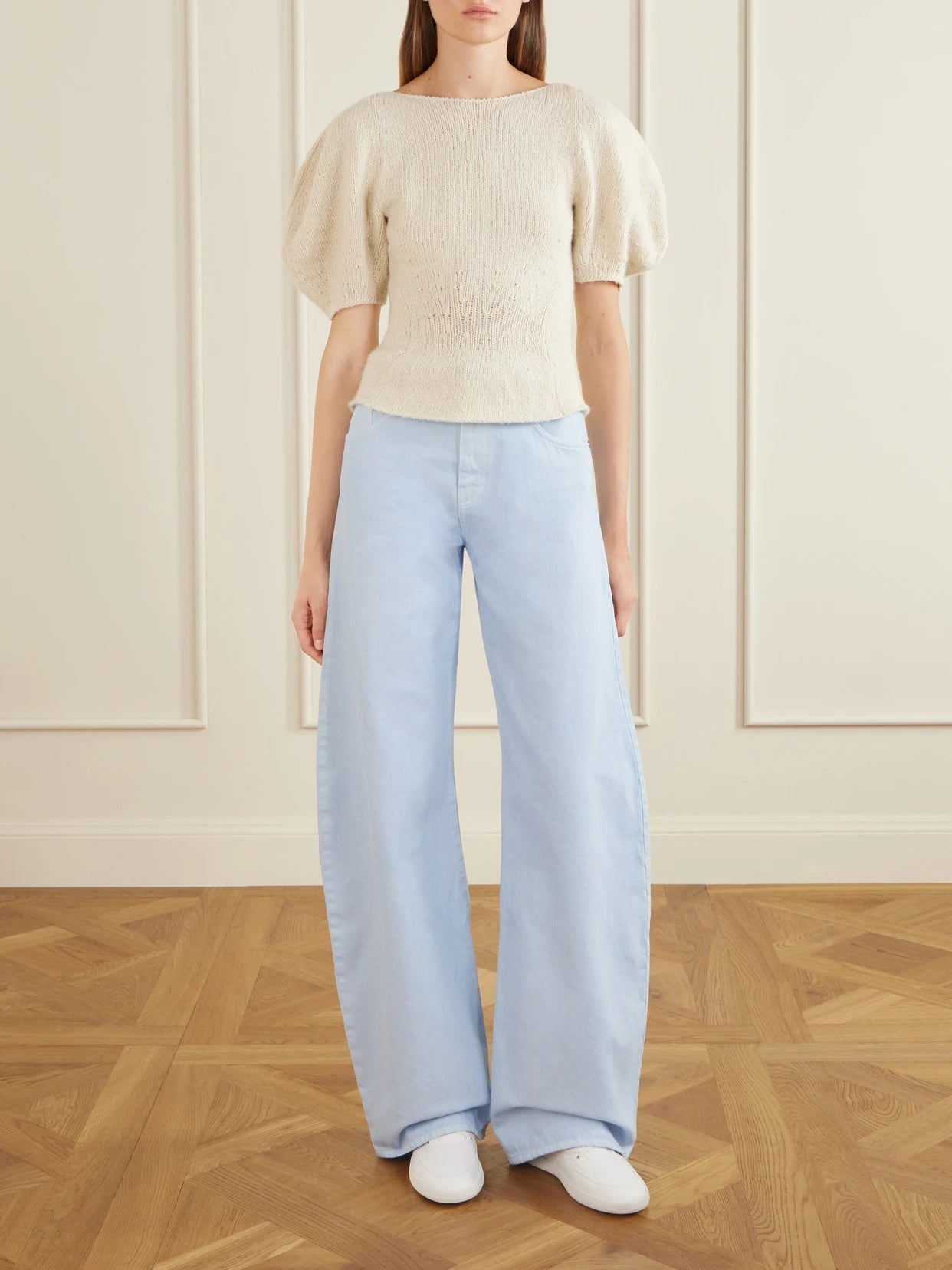 Image of a model wearing Outerwear. Product name - Vetala Knitted Cashmere Sweater in Ivory colour by brand - Gabriela Hearst