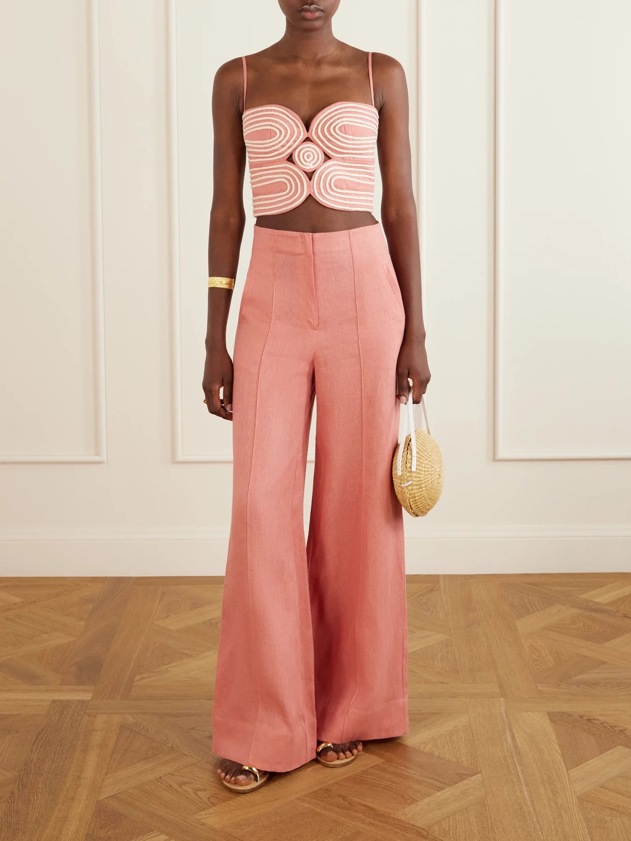 Image of a model wearing Pants. Product name - La Promesa Wide-leg Linen Pants in Pink colour by brand - Andres Otalora