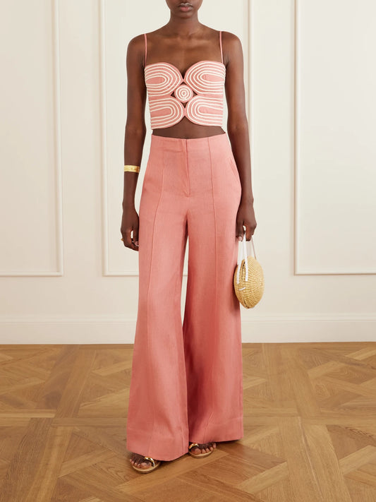 Image of a model wearing Pants. Product name - La Promesa Wide-leg Linen Pants in Pink colour by brand - Andres Otalora