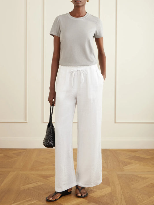 Image of a model wearing Pants. Product name - Linen Straight-leg Pants in White colour by brand - James Perse