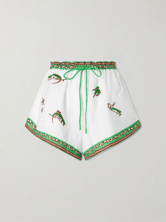 Image of a model wearing Shorts. Product name - Wanda Embroidered Linen Shorts in Ivory colour by brand - ALÉMAIS