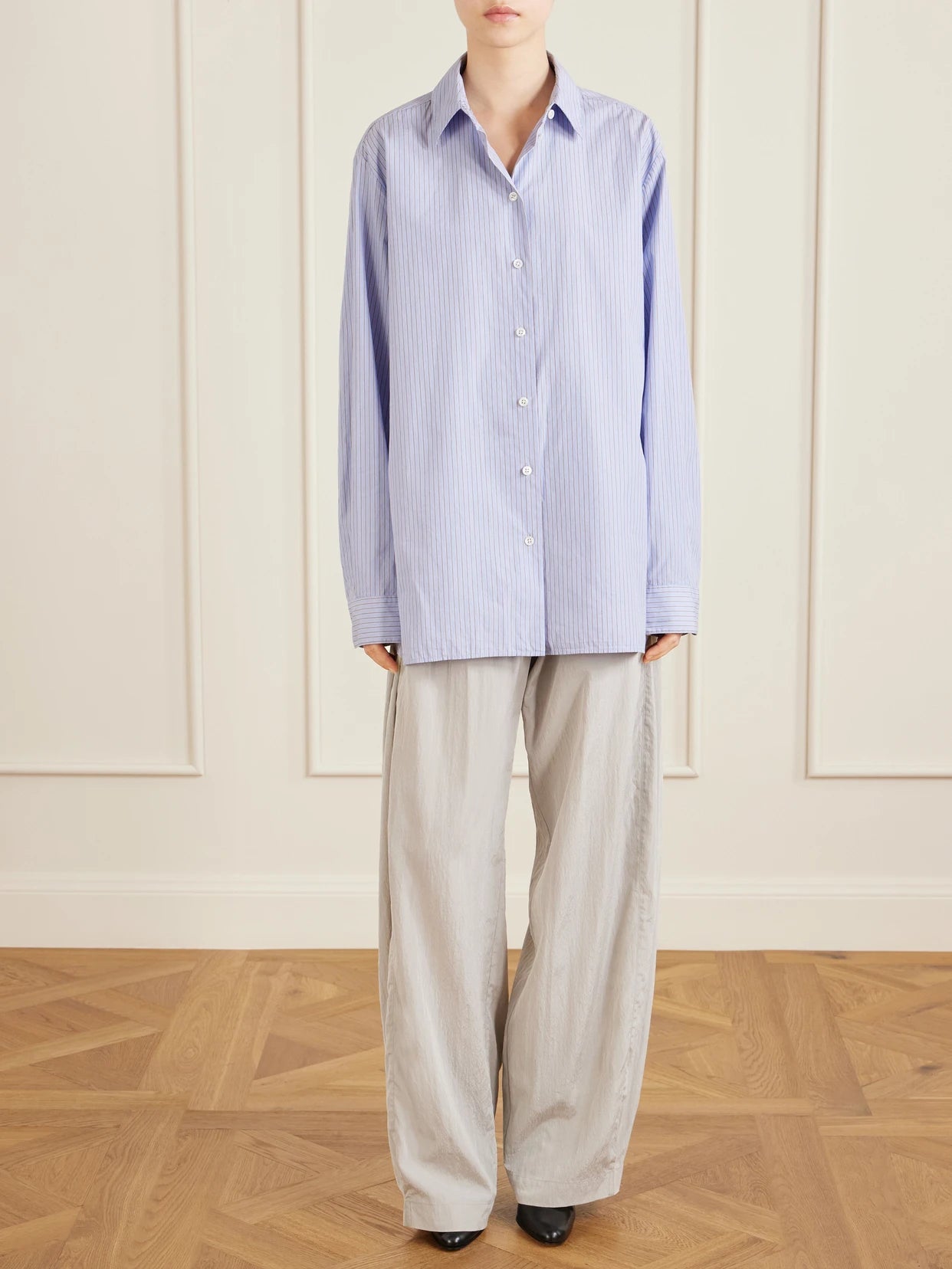Image of a model wearing Tops. Product name - Sisilia Cotton-poplin Shirt in Light blue colour by brand - The Row