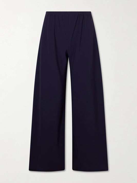 Image of a model wearing Pants. Product name - Cady Straight-leg Pants in Navy colour by brand - The Row
