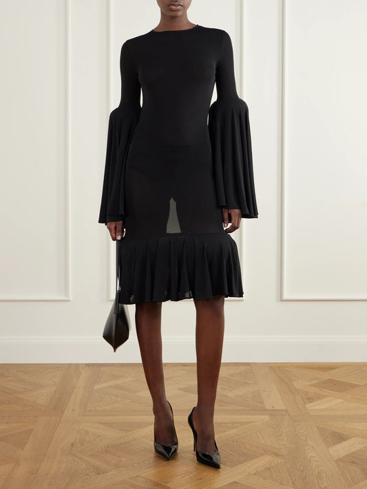 Image of a model wearing Skirts. Product name - Sculptural Gathered Knee-length Skirt in Black colour by brand - Jean Paul Gaultier