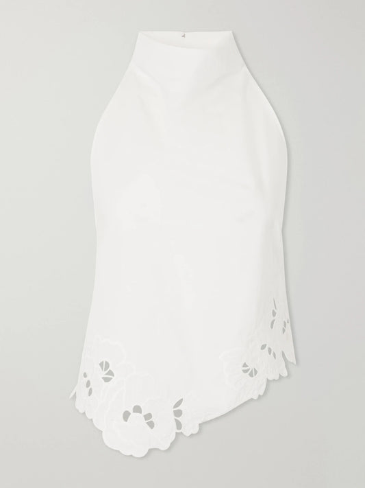 Image of a model wearing Tops. Product name - Klara Broderie Anglaise Cotton Turtleneck Top in Ivory colour by brand - SIR.