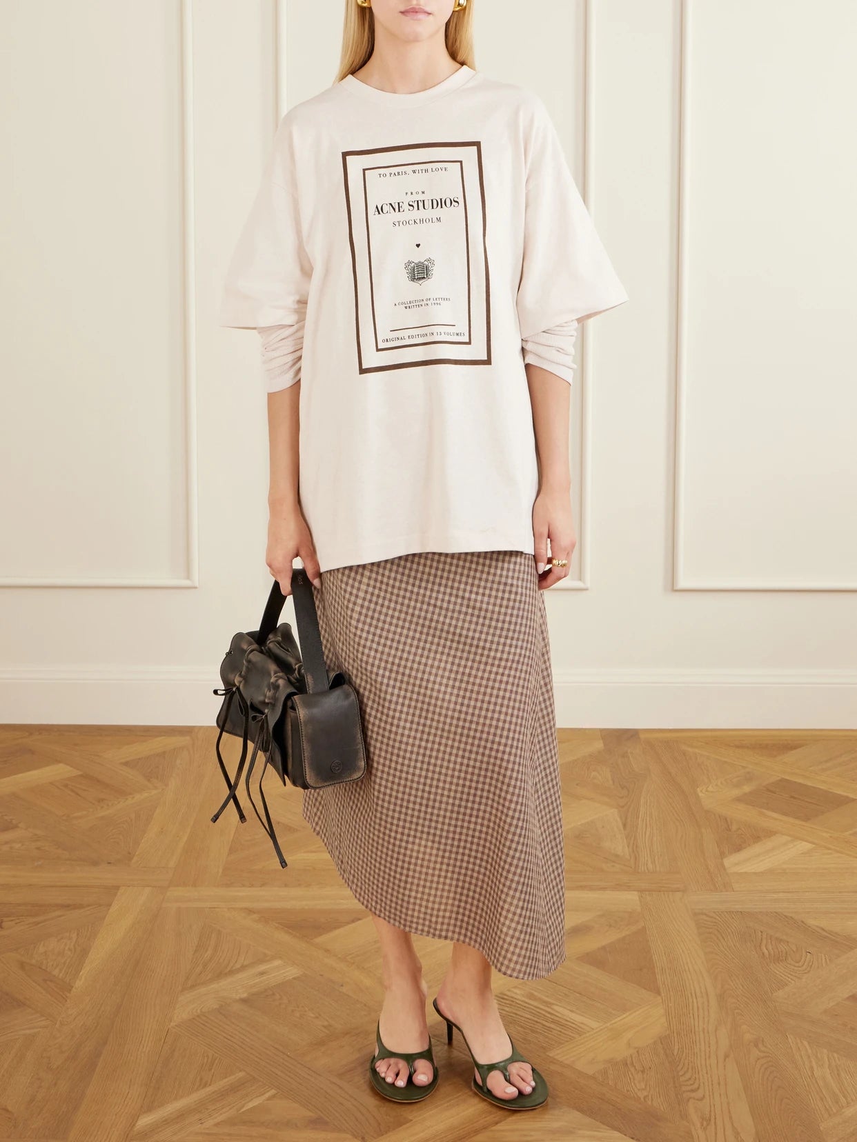 Image of a model wearing Tops. Product name - Edra Double Book Cover Printed Cotton-jersey T-shirt in Beige colour by brand - Acne Studios