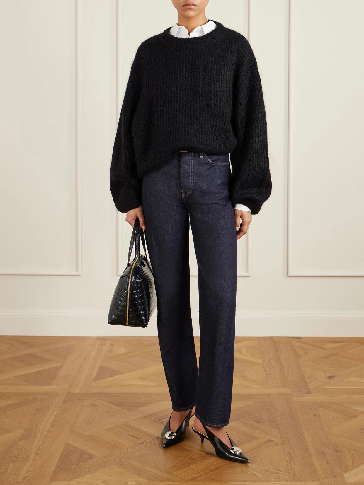 Image of a model wearing Outerwear. Product name - Ribbed Mohair-blend Sweater in Black colour by brand - TOTEME