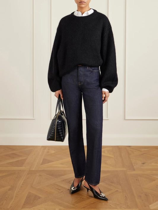 Image of a model wearing Outerwear. Product name - Ribbed Mohair-blend Sweater in Black colour by brand - TOTEME