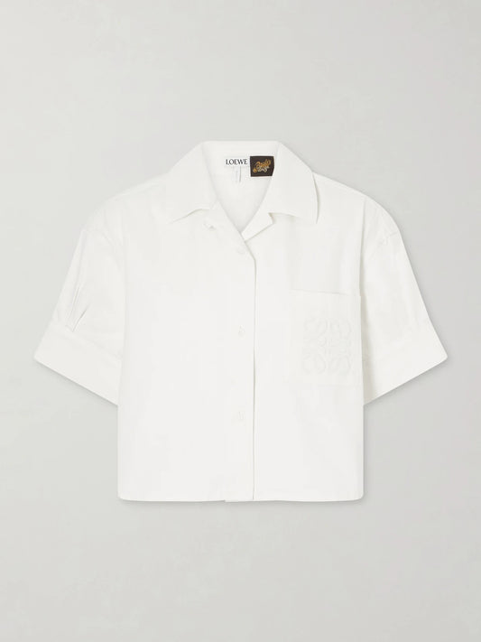 Image of a model wearing Tops. Product name - + Paula's Ibiza Anagram Cotton Shirt in White colour by brand - LOEWE