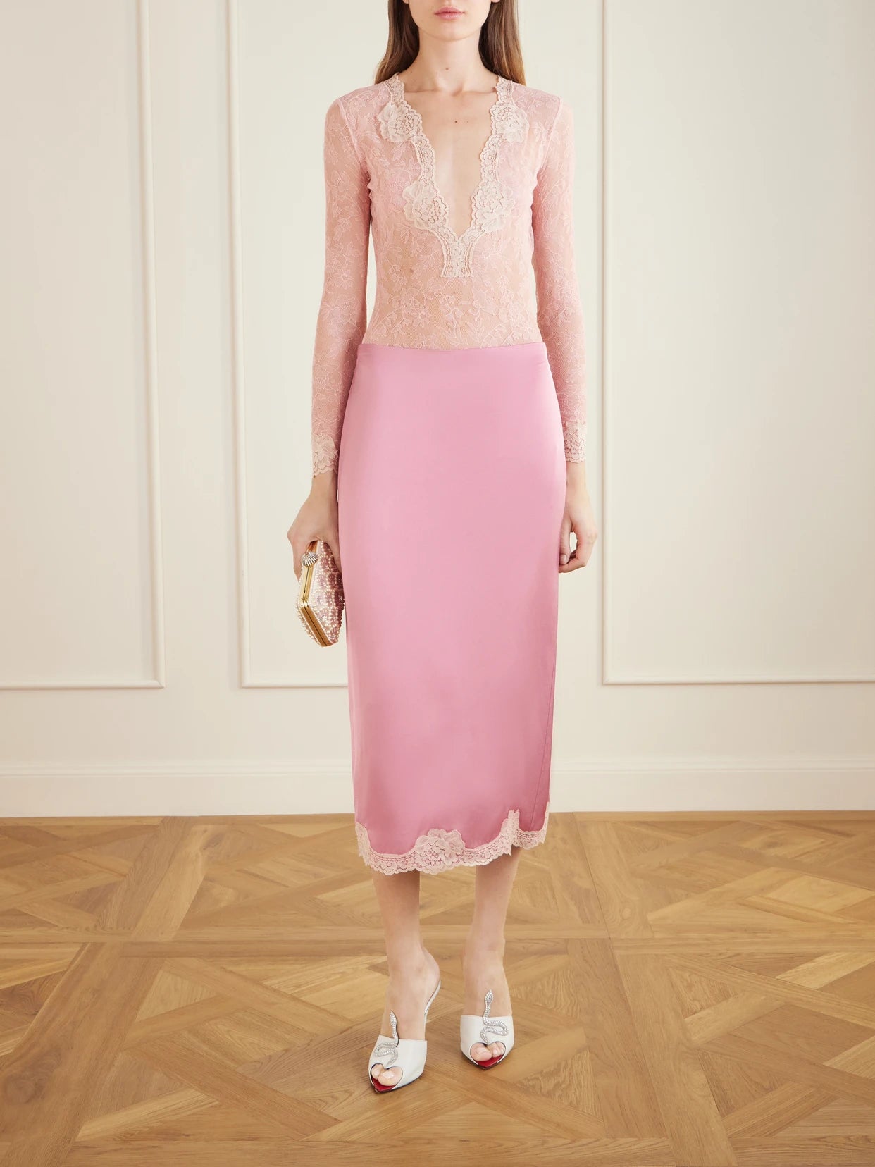 Image of a model wearing Tops. Product name - Stretch-lace Bodysuit in Pink colour by brand - Valentino Garavani