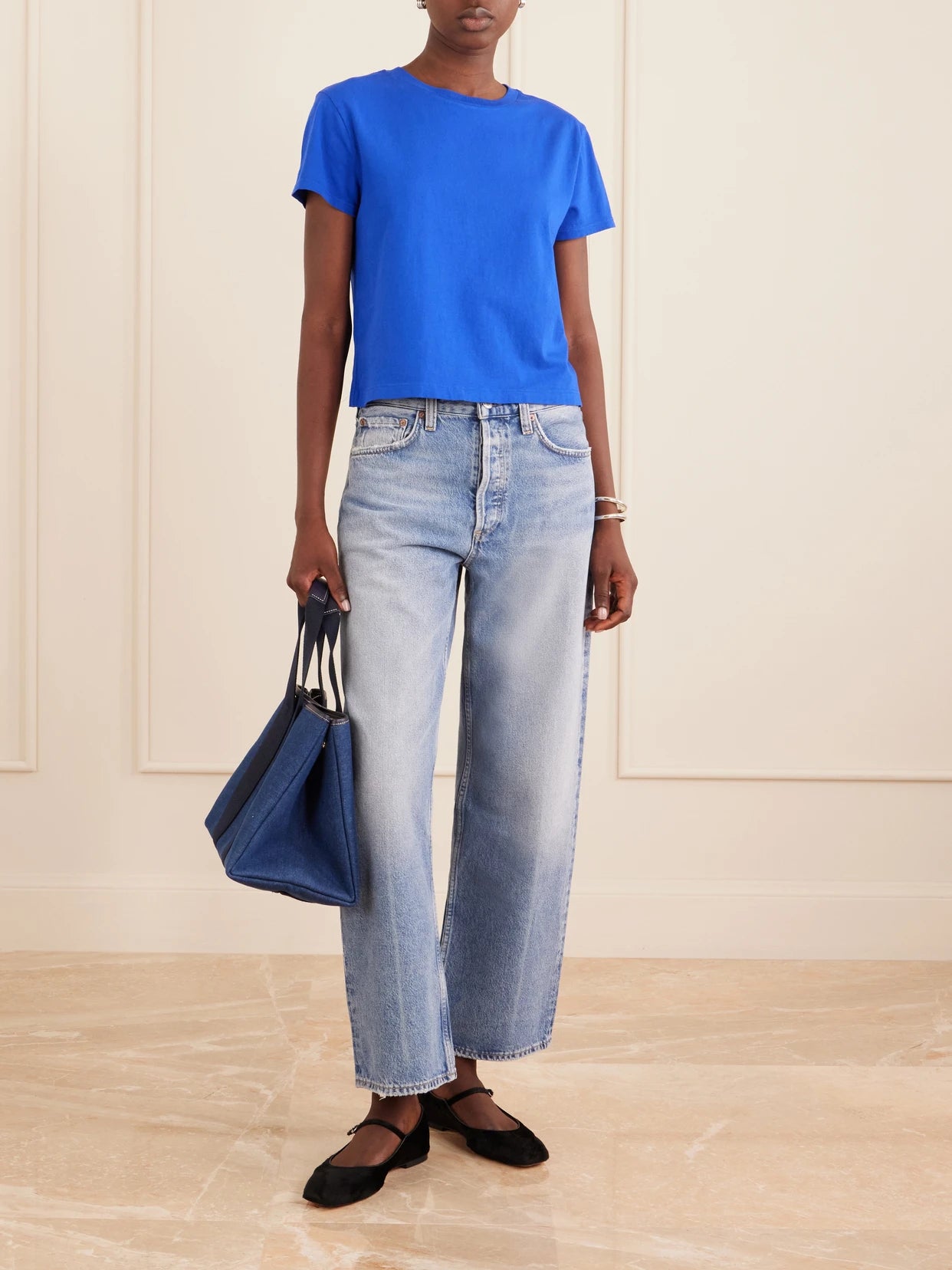 Image of a model wearing Tops. Product name - Adine Cropped Organic Cotton-jersey T-shirt in Cobalt blue colour by brand - AGOLDE