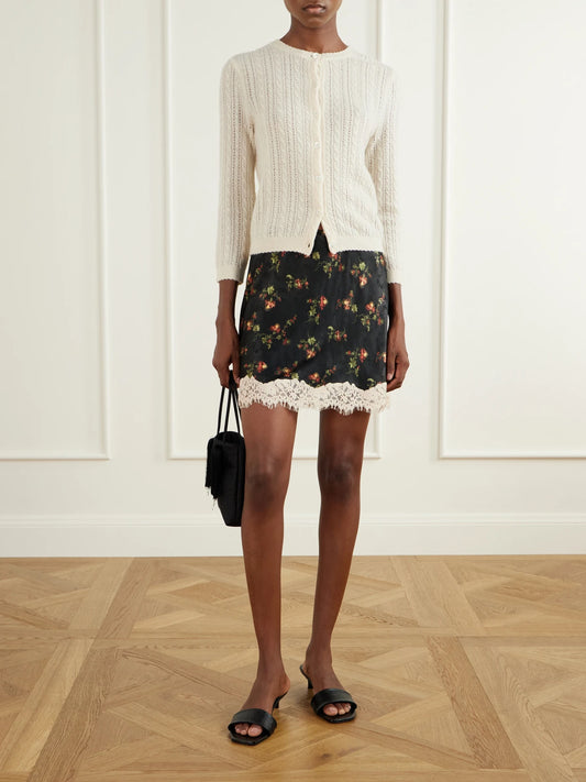 Image of a model wearing Skirts. Product name - Giulietta Lace-trimmed Floral-jacquard Mini Skirt in Multi colour by brand - DÔEN