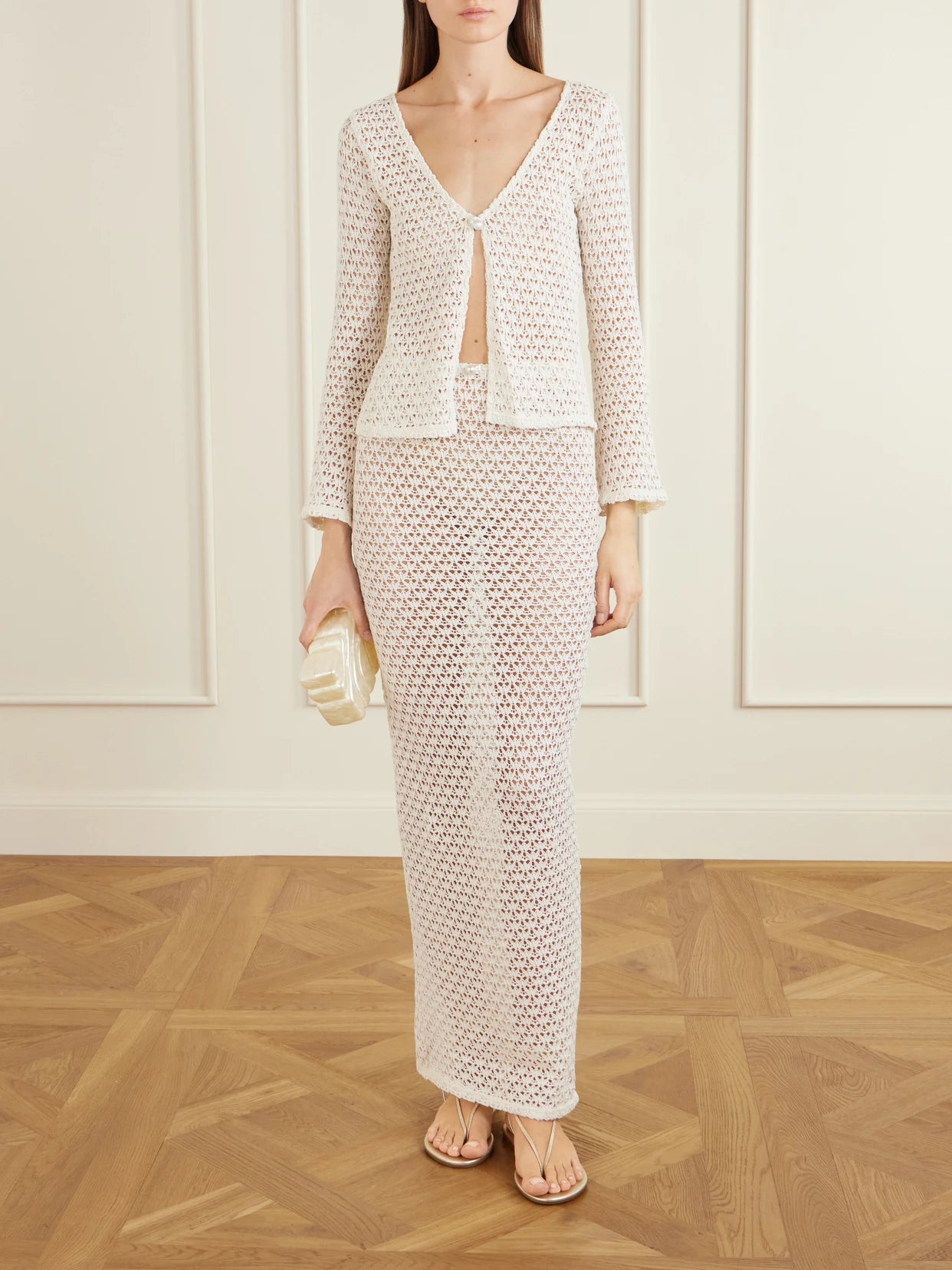 Image of a model wearing Skirts. Product name - Arena Crocheted Cotton Coverup in Ecru colour by brand - Sara Cristina
