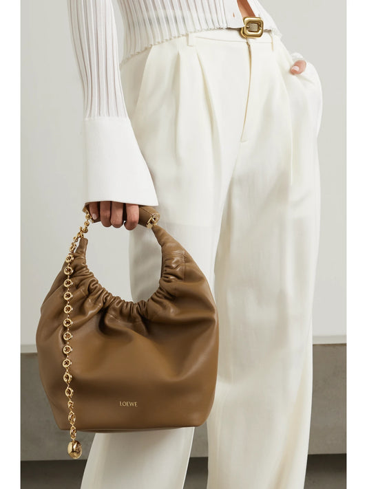 Image of Bags. Product name - Squeeze Small Chain-embellished Gathered Leather Shoulder Bag in Tan colour by brand - LOEWE