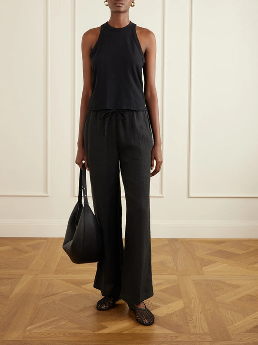 Image of a model wearing Tops. Product name - Slub Cotton-jersey Tank Top in Black colour by brand - James Perse