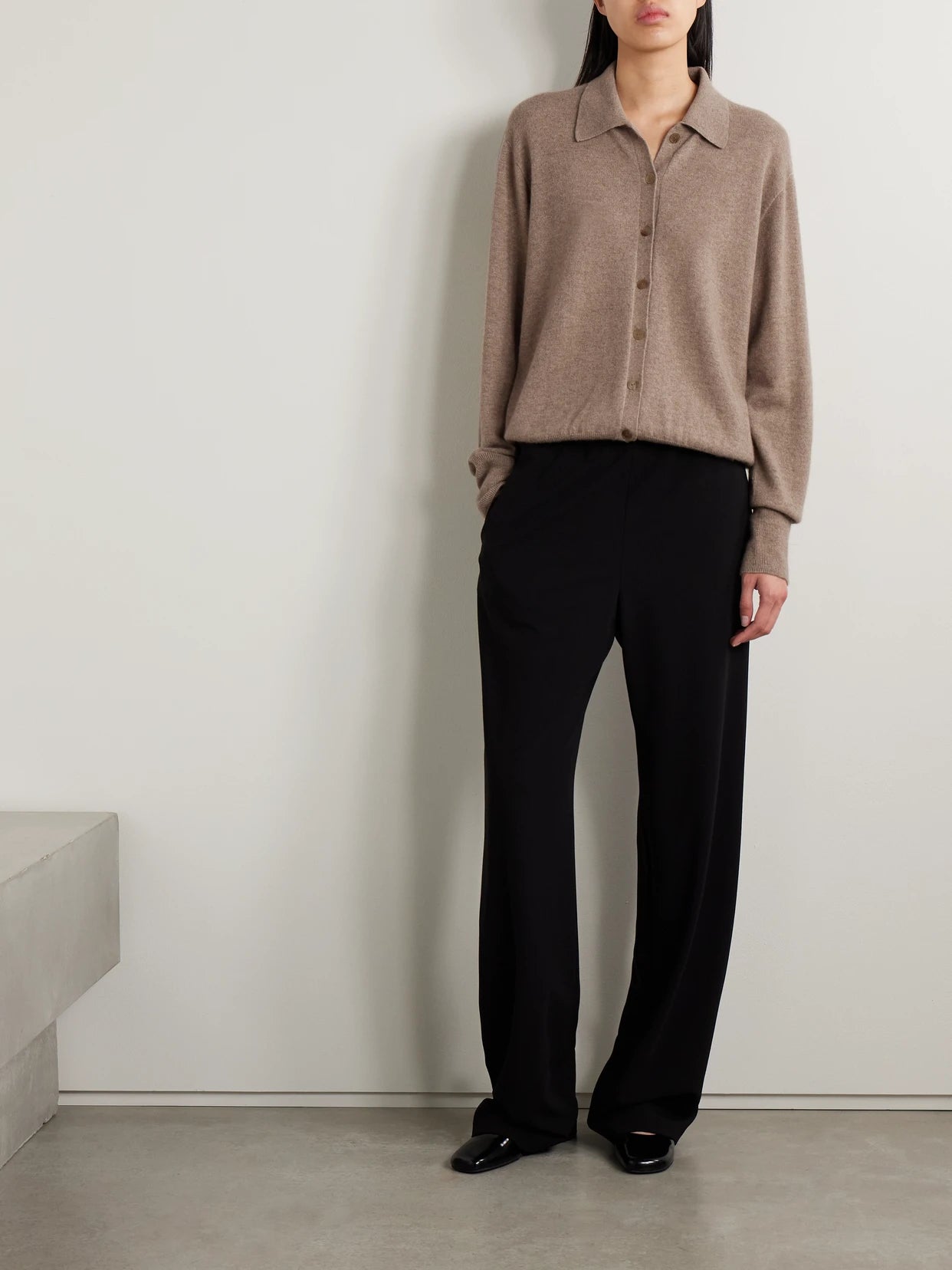 Image of a model wearing Outerwear. Product name - Lillia Cashmere Cardigan in Taupe colour by brand - The Row