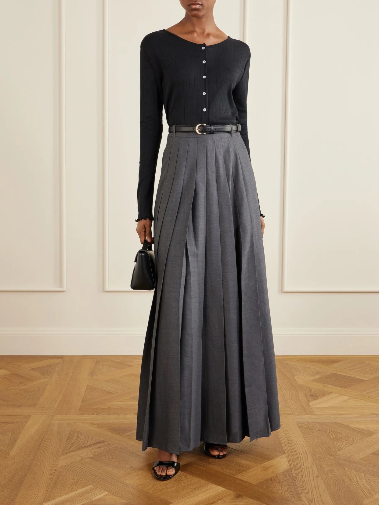 Image of a model wearing Skirts. Product name - Belted Pleated Woven Grain De Poudre Maxi Skirt in Gray colour by brand - Self-Portrait