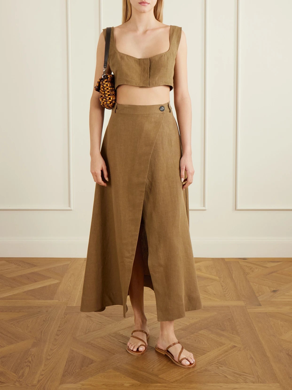 Image of a model wearing Skirts. Product name - Rayi Linen Maxi Skirt in Brown colour by brand - Le Kasha