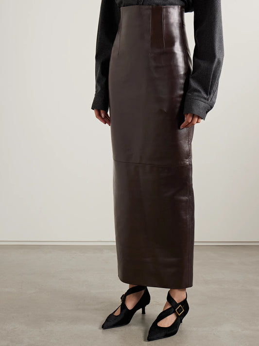 Image of a model wearing Skirts. Product name - Loxley Leather Maxi Skirt in Dark brown colour by brand - KHAITE